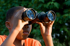 boy birding with binoculars