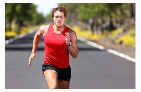 Man Sprinting Down Road